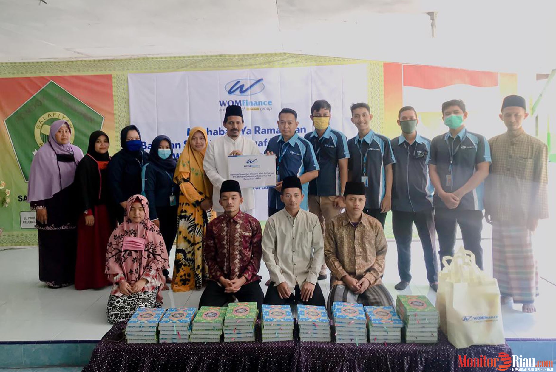 WOM Finance Bagikan Al-Quran